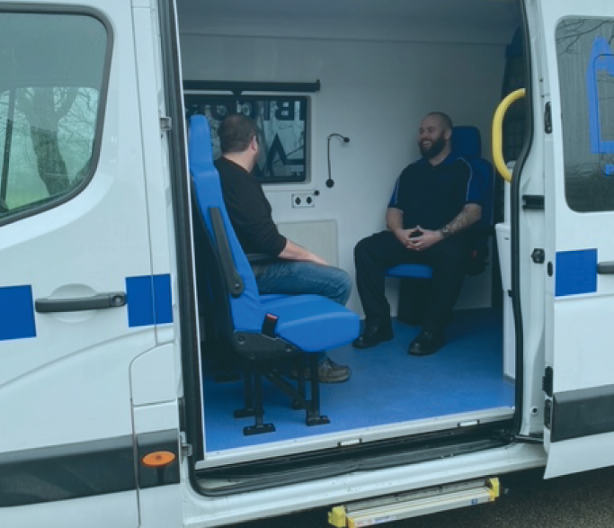 Ambicorp Secure staff in ambulance talking